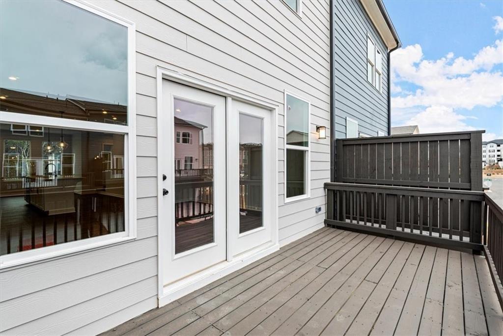 741 Payton Lane Acworth, GA 30102 - Photo 18 of 36 a view of a wooden deck with a bench