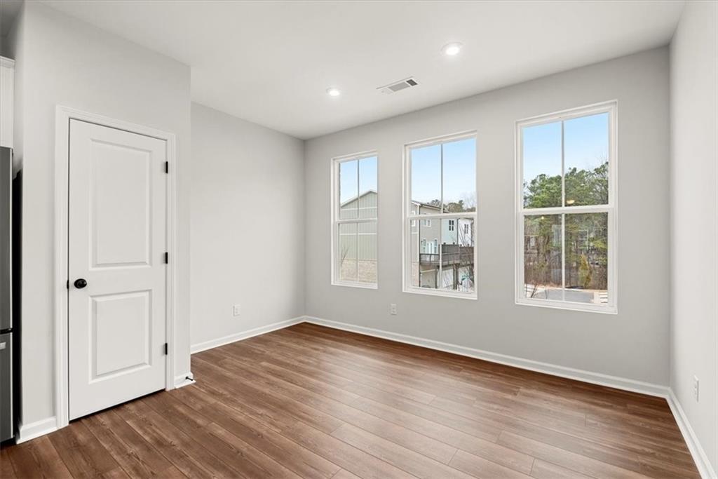 741 Payton Lane Acworth, GA 30102 - Photo 21 of 36 a view of empty room with wooden floor and entryway