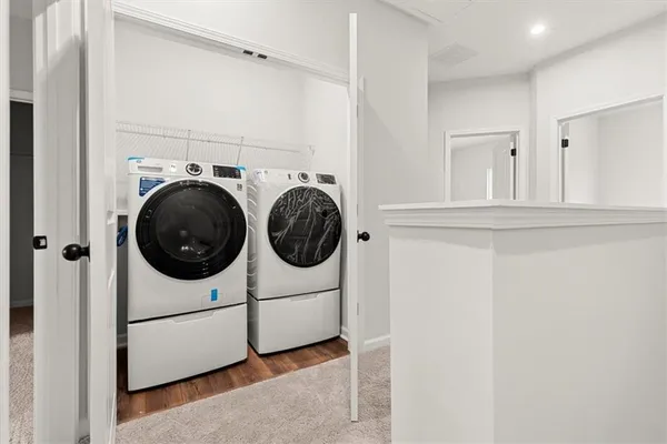 a utility room with dryer and washer