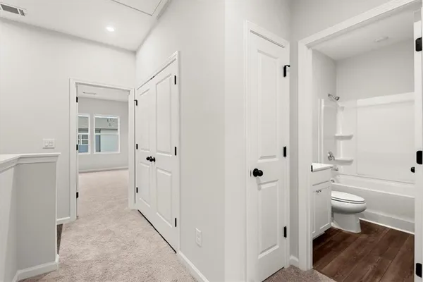 a bathroom with a toilet a sink and a bathtub