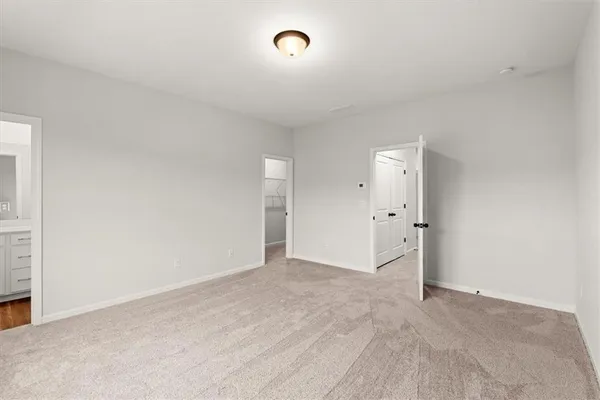 a bathroom with a sink toilet vanity and shower