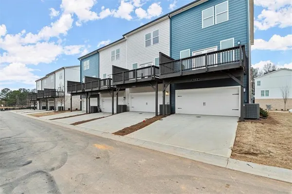 a front view of a house with a garage