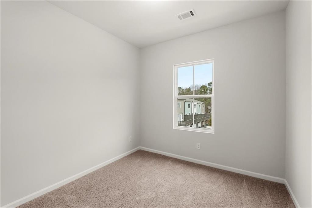 741 Payton Lane Acworth, GA 30102 - Photo 34 of 36 a view of an empty room and window
