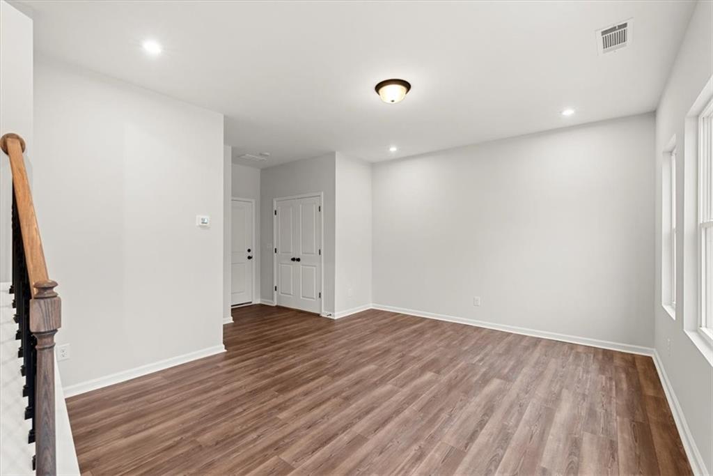741 Payton Lane Acworth, GA 30102 - Photo 6 of 36 a view of an empty room with wooden floor and a window