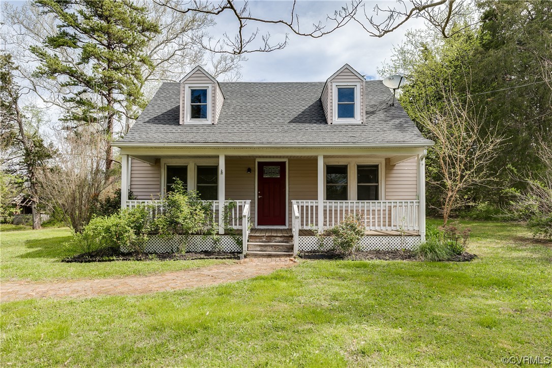 4144 Broad St Road Gum Spring, VA 23065 - Photo 1 of 34 a front view of a house with garden