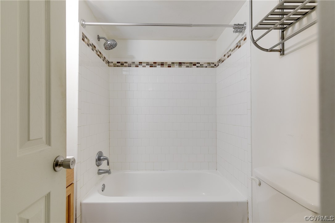 4144 Broad St Road Gum Spring, VA 23065 - Photo 13 of 34 a bathroom with a bathtub and a shower