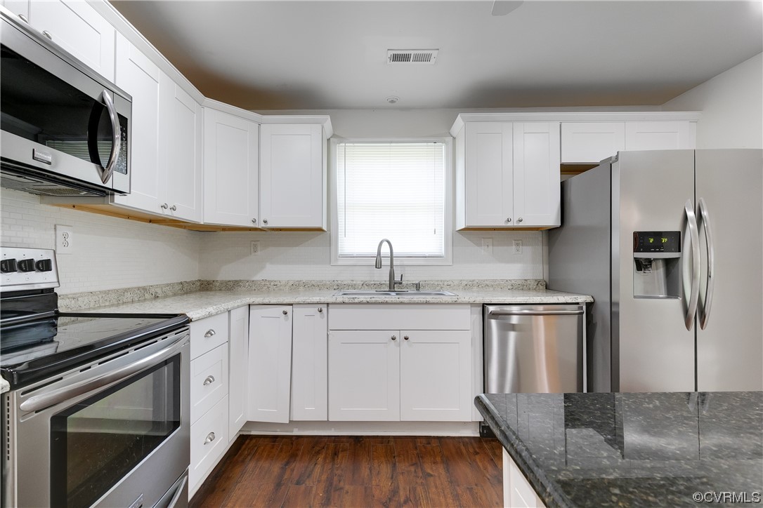 4144 Broad St Road Gum Spring, VA 23065 - Photo 16 of 34 a kitchen with stainless steel appliances granite countertop a sink stove and microwave