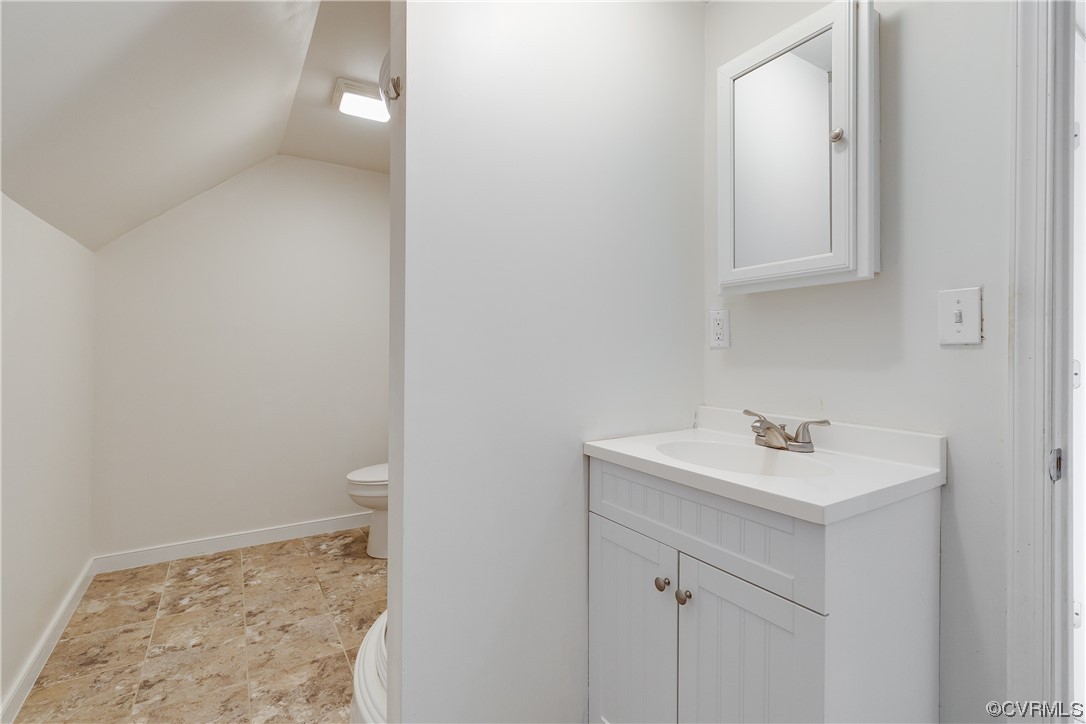 4144 Broad St Road Gum Spring, VA 23065 - Photo 26 of 34 a bathroom with a sink toilet and vanity