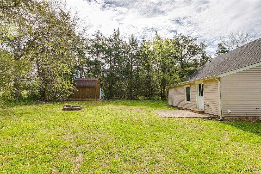 4144 Broad St Road Gum Spring, VA 23065 - Photo 29 of 34 a backyard of a house with lots of green space