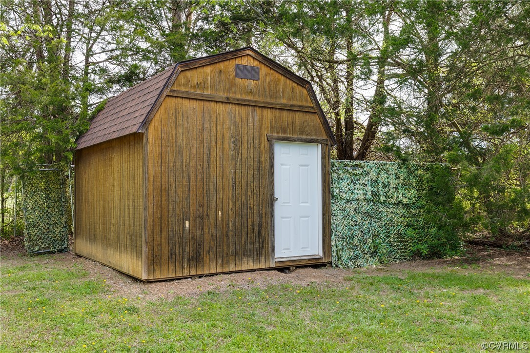 4144 Broad St Road Gum Spring, VA 23065 - Photo 31 of 34 a view of backyard with small cabin and wooden fence