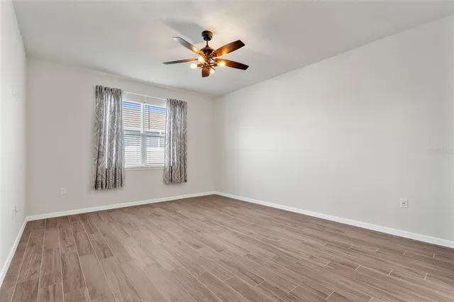 a bathroom with a shower sink and mirror