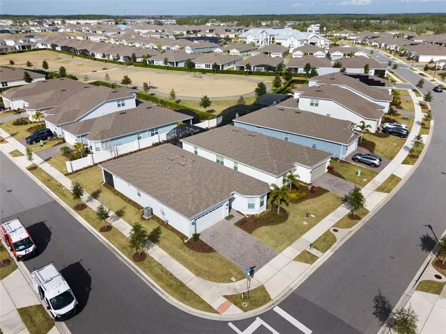 a living room with lots of furniture and a wooden floor