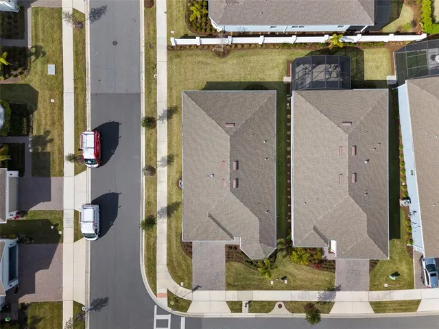 a living room with furniture and view of kitchen