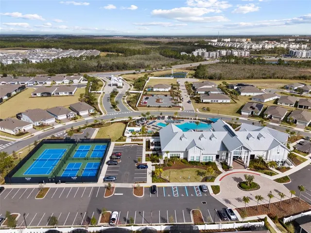 a very nice looking living room with furniture and floor to ceiling windows