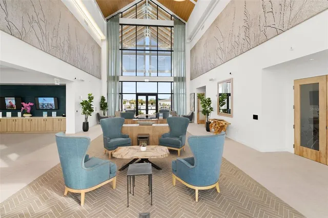 a view of a swimming pool with lounge chairs