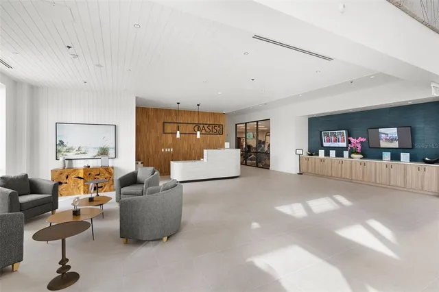 a view of a swimming pool with a table and chairs