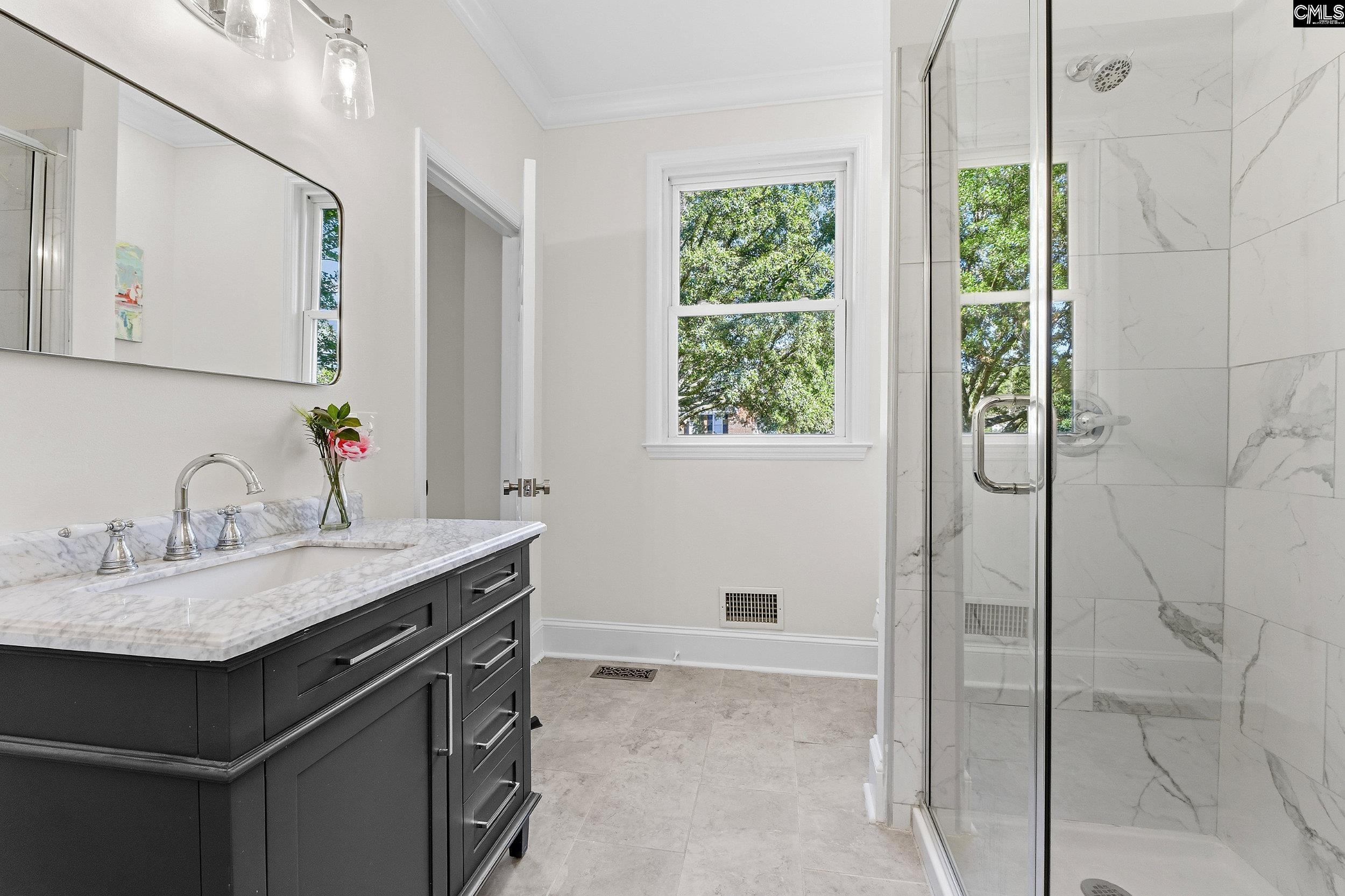 121 Silver Lake Road East Columbia, SC 29223 - Photo 31 of 57 a bathroom with a granite countertop sink a mirror and a shower