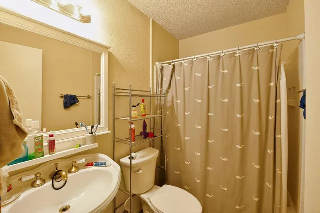 a view of storage and utility room with a washer dryer and bicycles