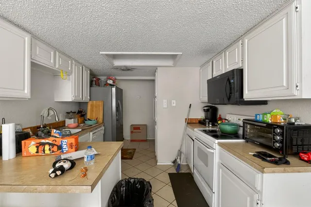 a work room with furniture and a window