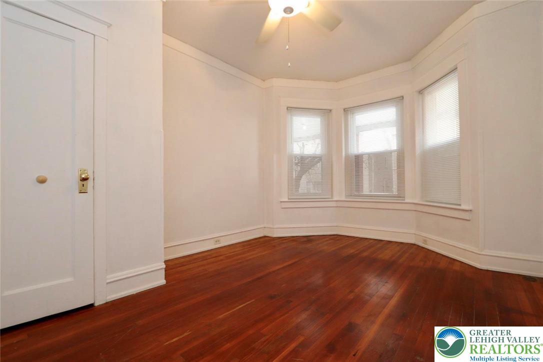 728 East 6th Street, Unit 1 Bethlehem, PA 18015 - Photo 6 of 15 wooden floor in an empty room with a window