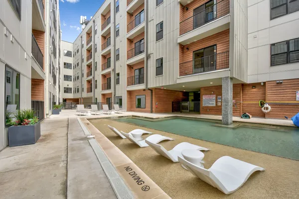 a view of a building with a yard