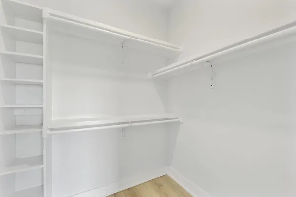a view of an empty walk in closet