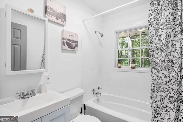 a bathroom with a bathtub and a sink