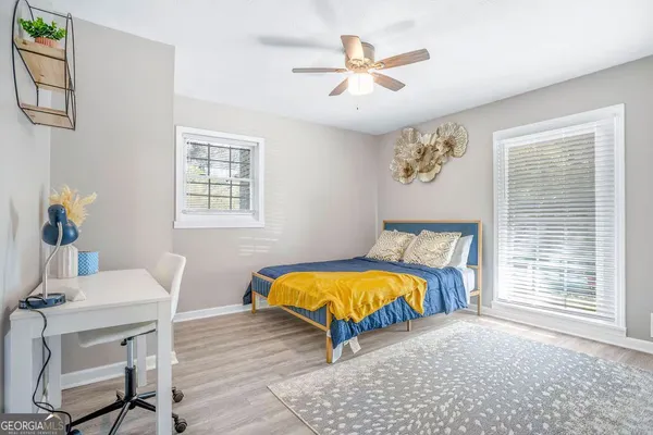 a bedroom with a bed and a table in it