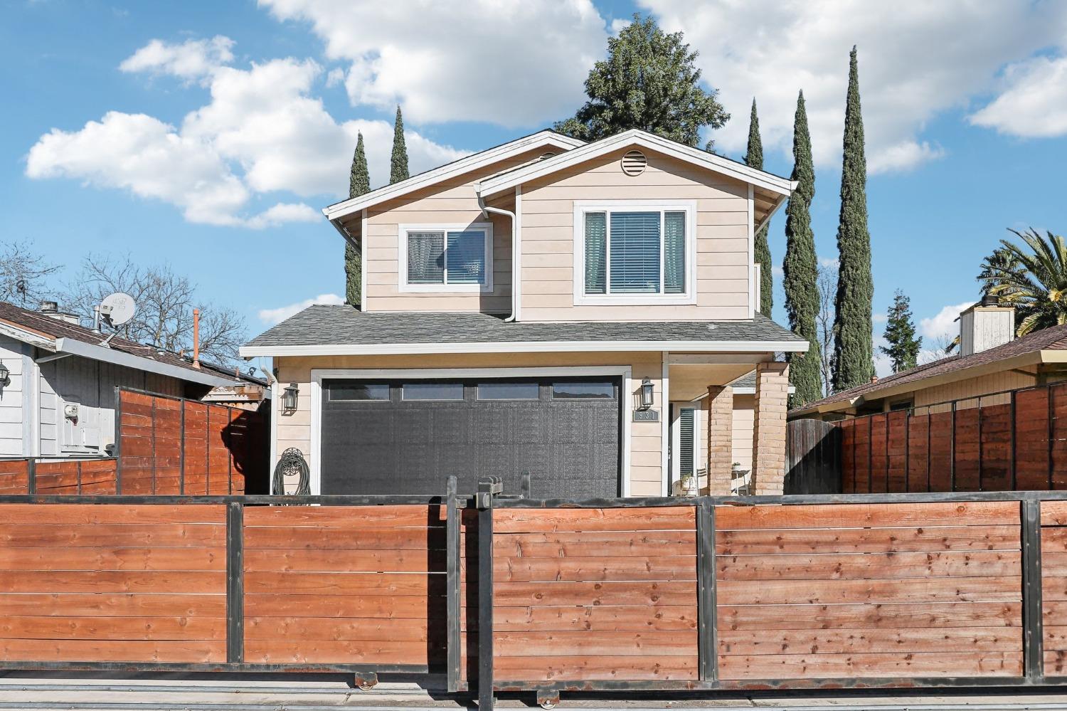 931 Rancho Roble Way Sacramento, CA 95834 - Photo 1 of 1 a front view of a house with large windows
