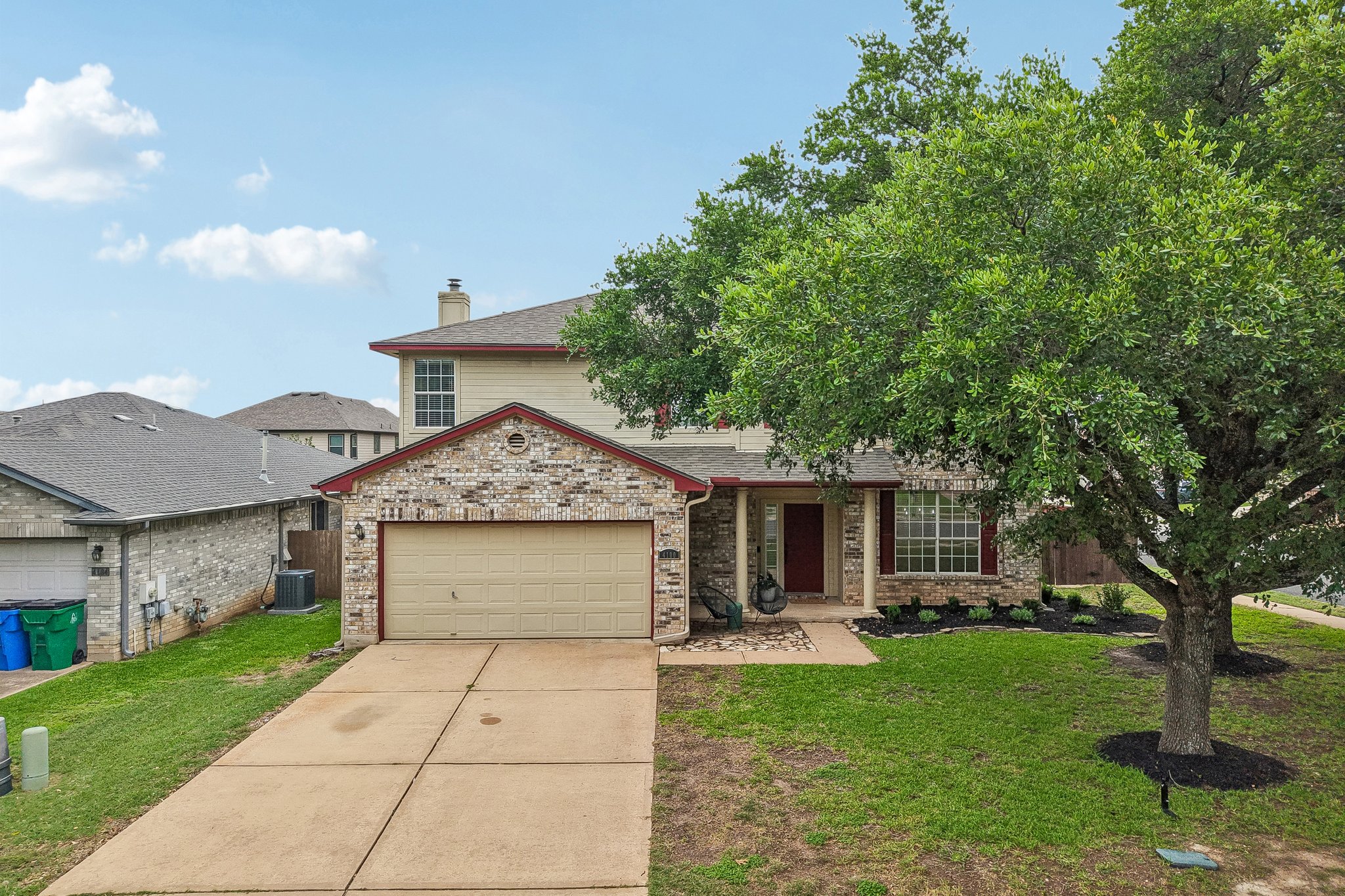4100 Mocha Trail Austin, TX 78728 - Photo 28 of 33 A classic brick-front residence presents a welcoming facade, framed by verdant landscaping and mature trees.