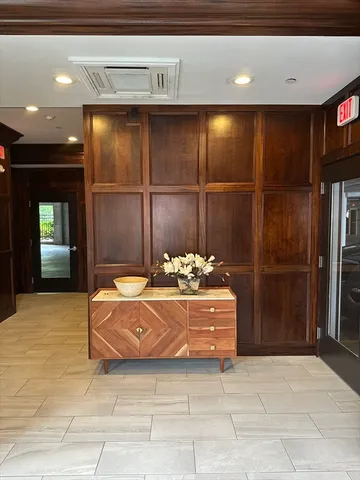 a living room with hard wood flooring and furniture