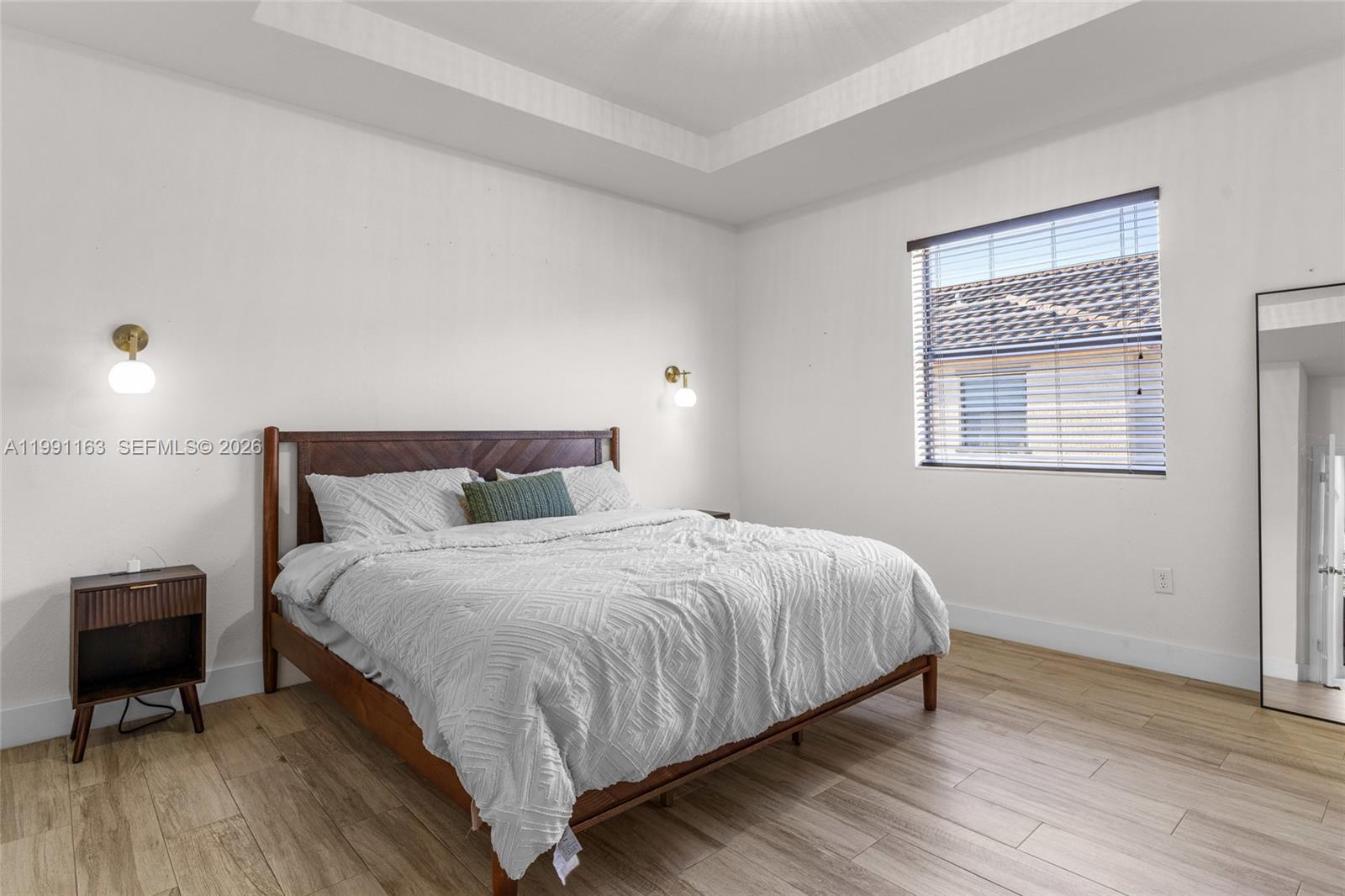 11429 Southwest 253rd Street Homestead, FL 33032 - Photo 15 of 30 a large bed sitting in a bedroom next to a window