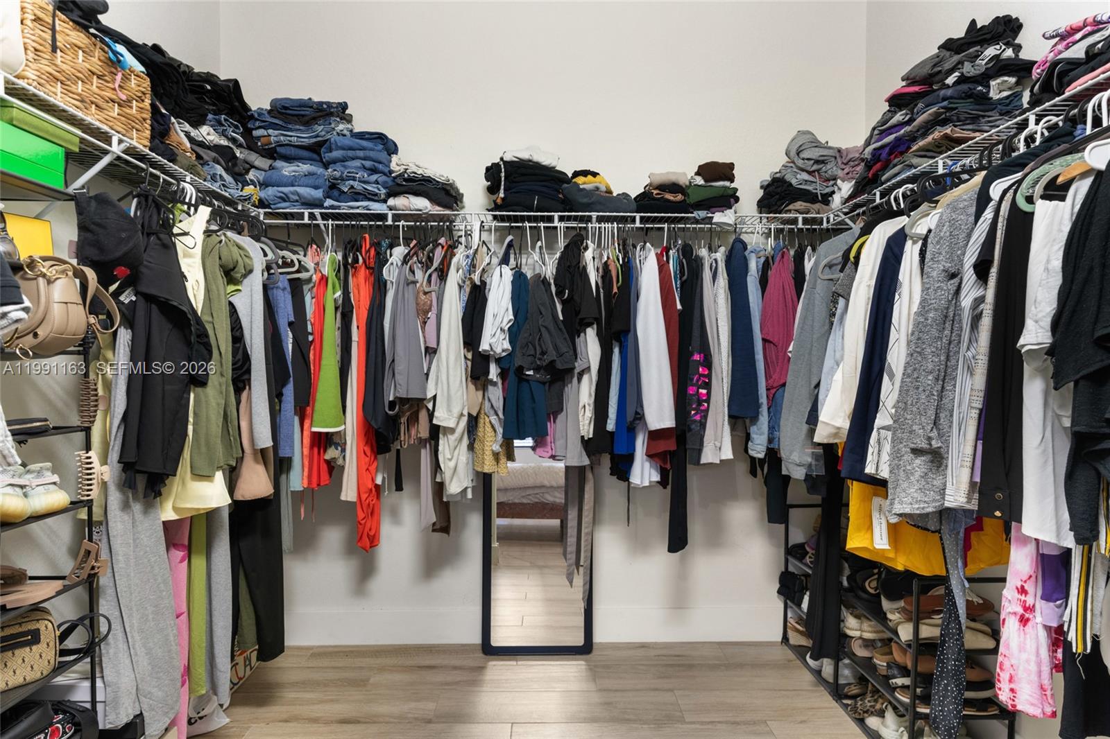 11429 Southwest 253rd Street Homestead, FL 33032 - Photo 18 of 30 a view of walk in closet with clothes and shoes