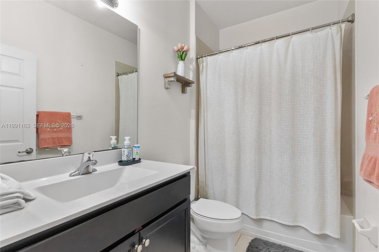 11429 Southwest 253rd Street Homestead, FL 33032 - Photo 21 of 30 a bathroom with a sink and a mirror