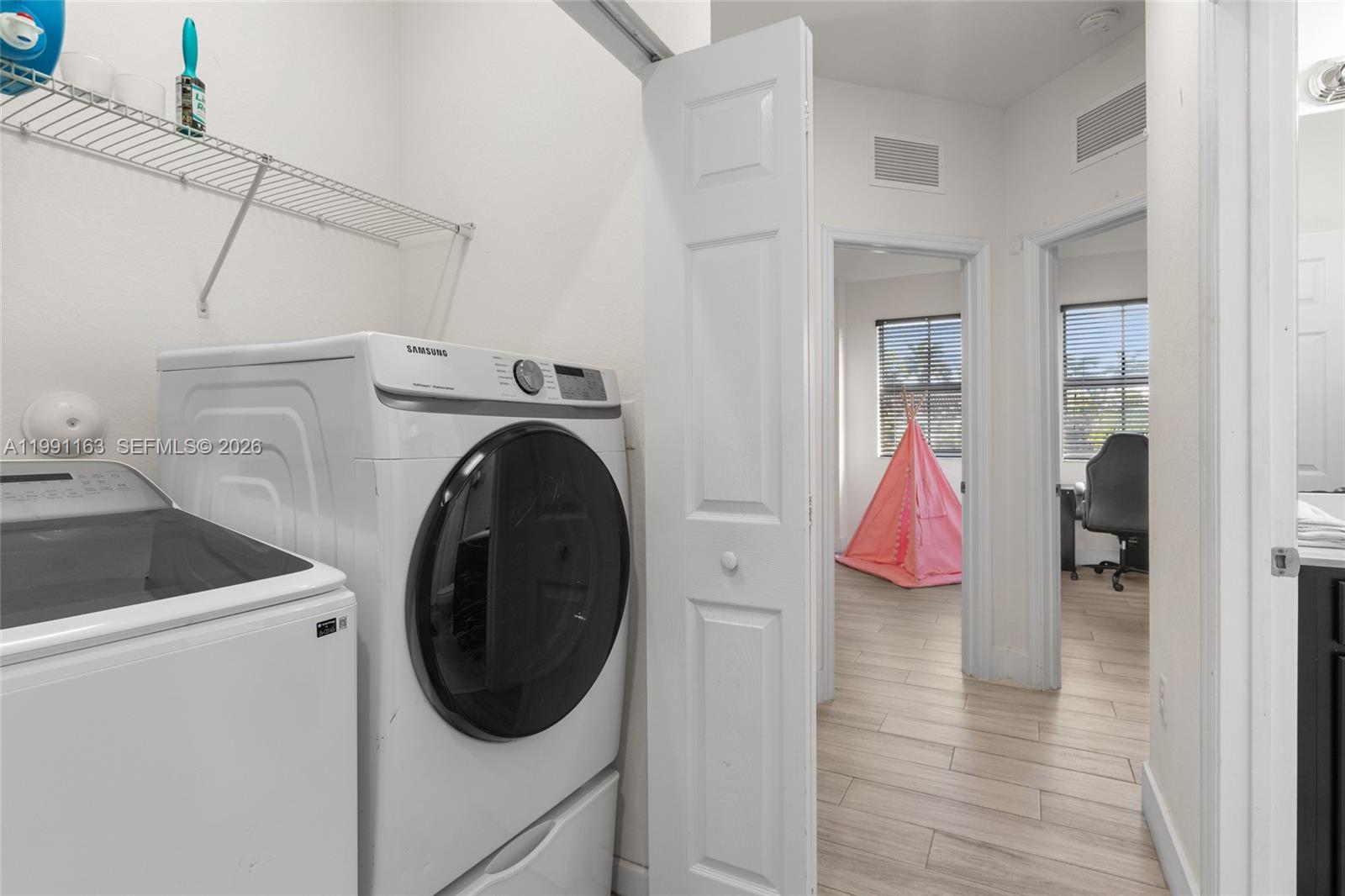 11429 Southwest 253rd Street Homestead, FL 33032 - Photo 22 of 30 a view of walk in closet with clothes and shoes