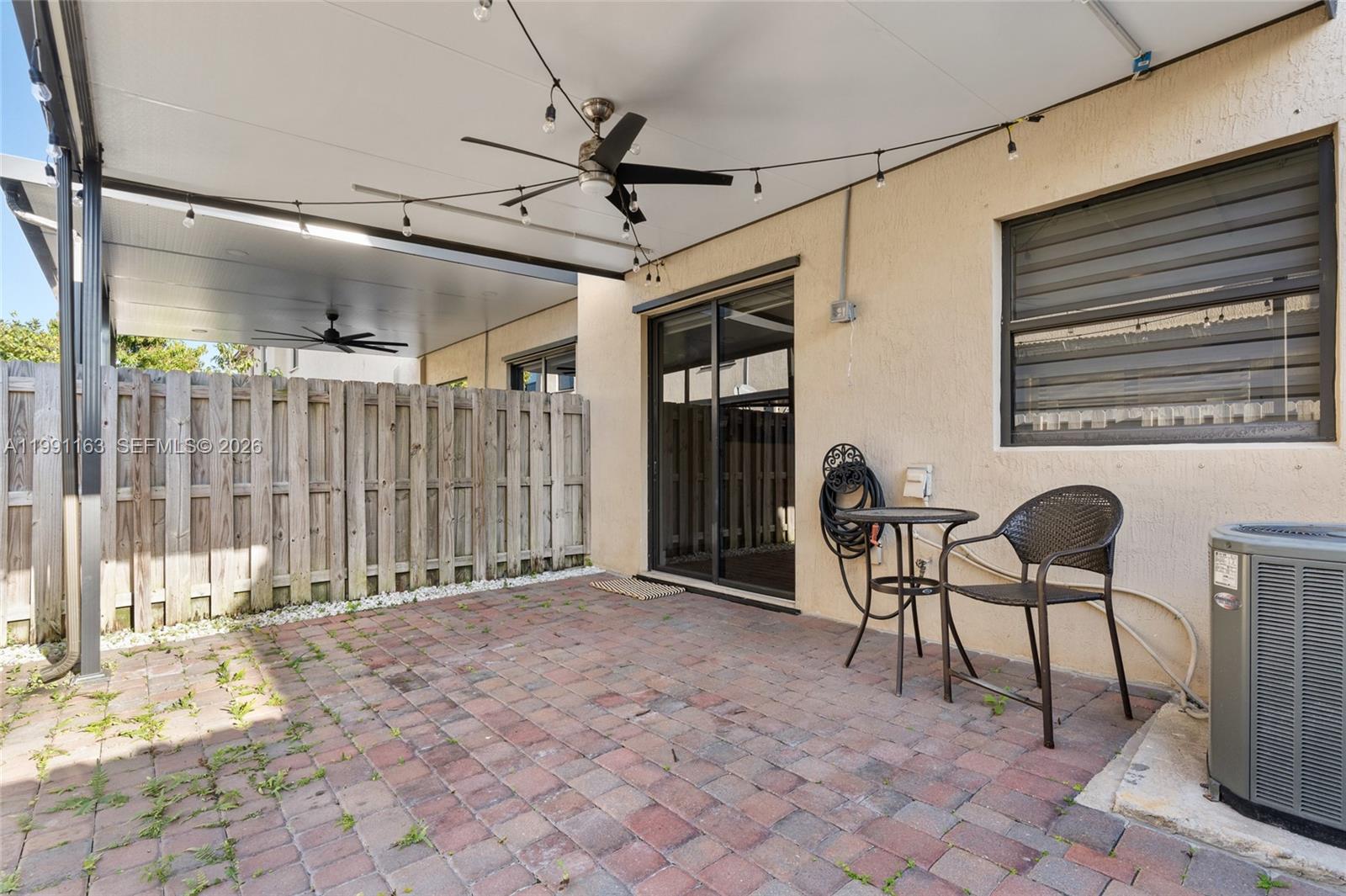 11429 Southwest 253rd Street Homestead, FL 33032 - Photo 25 of 30 a view of a chairs and table in a patio