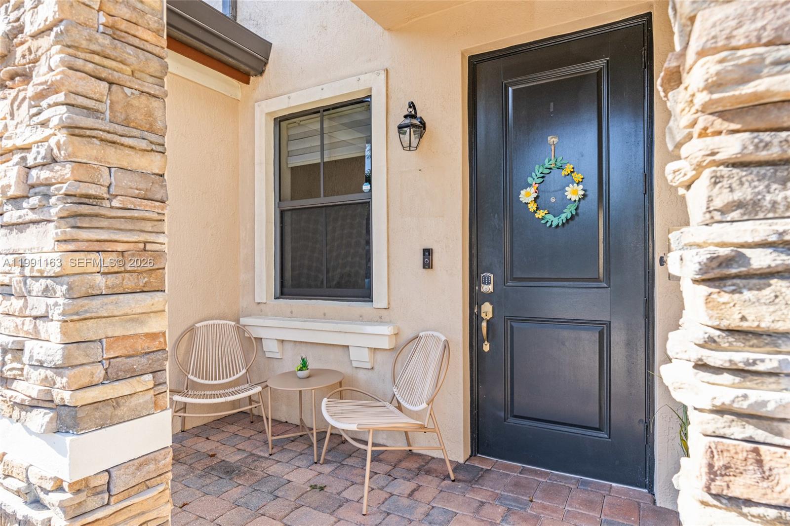 11429 Southwest 253rd Street Homestead, FL 33032 - Photo 3 of 30 a front view of a house with outdoor seating