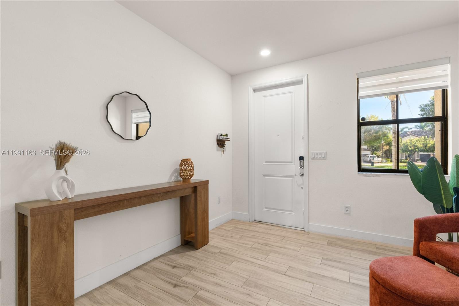 11429 Southwest 253rd Street Homestead, FL 33032 - Photo 4 of 30 a view of a livingroom with furniture and windows