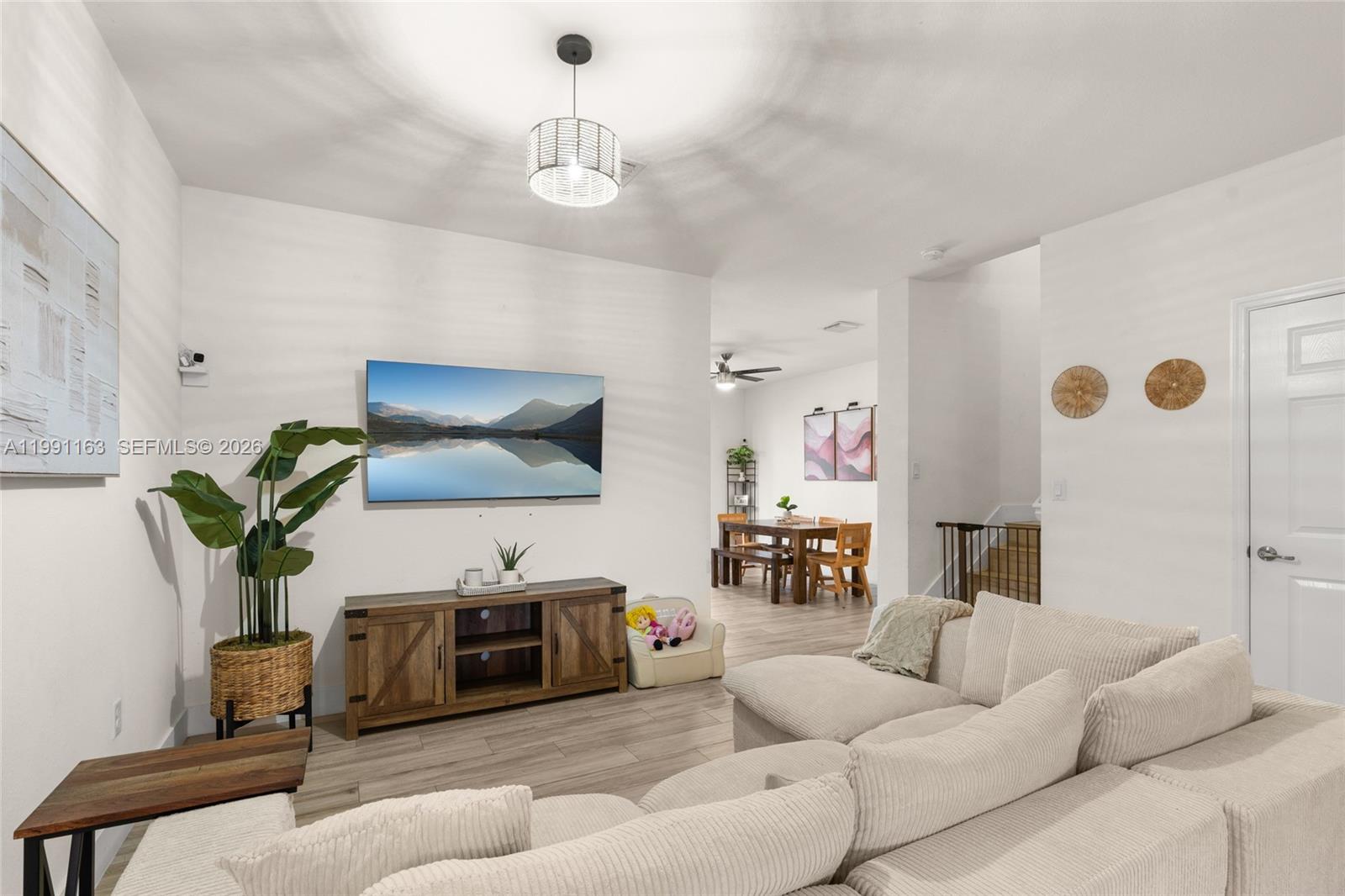 11429 Southwest 253rd Street Homestead, FL 33032 - Photo 6 of 30 a living room with furniture and a flat screen tv