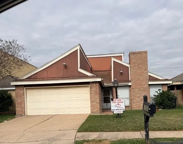 a front view of a house with yard
