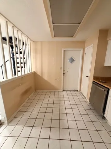 a kitchen with stainless steel appliances granite countertop a refrigerator sink and stove