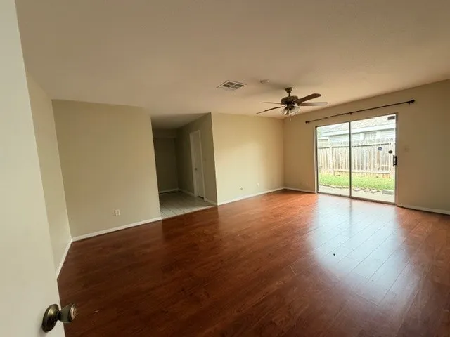 a spacious bathroom with a double vanity sink mirror and shower