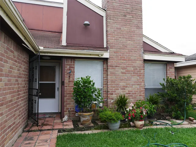 a house with garden in front of it