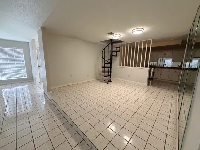 a view of entryway with stairs and a window