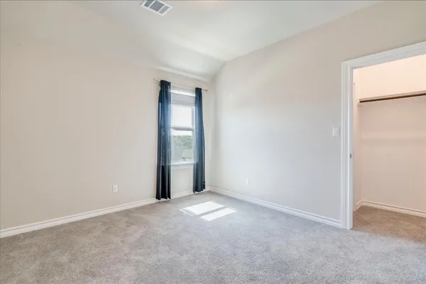 a view of an empty room and window