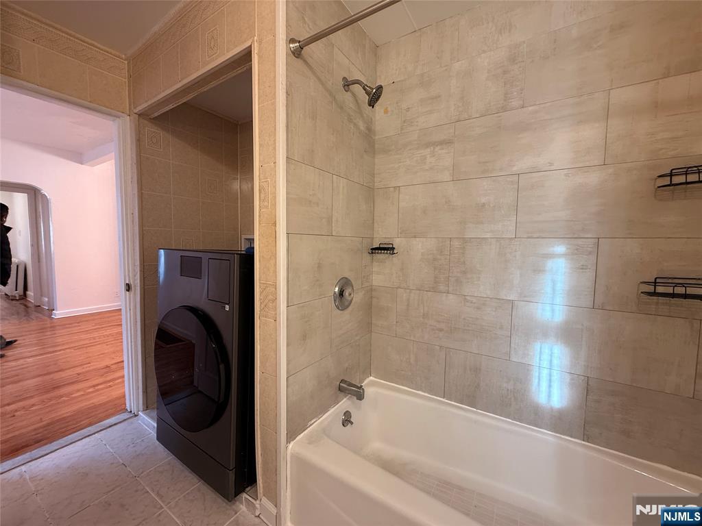 86 West Main Street, Unit FIRST Bergenfield, NJ 07621 - Photo 12 of 23 a view of bathroom with bathtub and shower