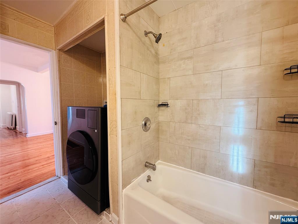 86 West Main Street, Unit FIRST Bergenfield, NJ 07621 - Photo 13 of 23 a bathroom with a bathtub and a shower