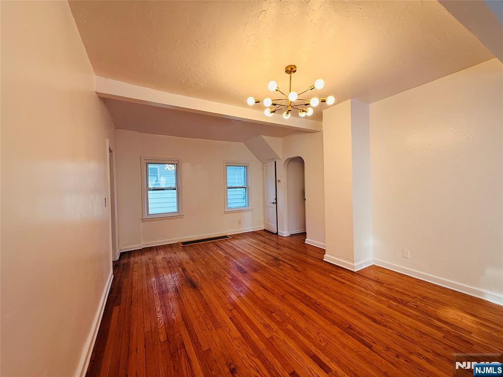 86 West Main Street, Unit FIRST Bergenfield, NJ 07621 - Photo 18 of 23 a view of empty room with wooden floor and fan