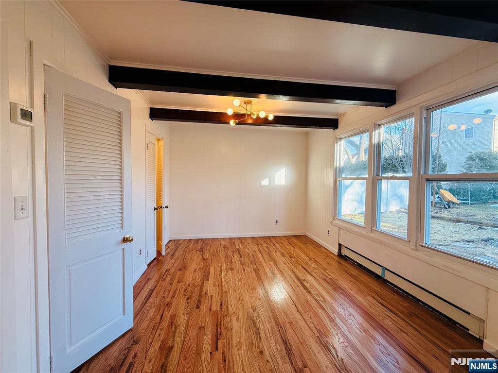 86 West Main Street, Unit FIRST Bergenfield, NJ 07621 - Photo 20 of 23 a view of empty room with wooden floor and fan