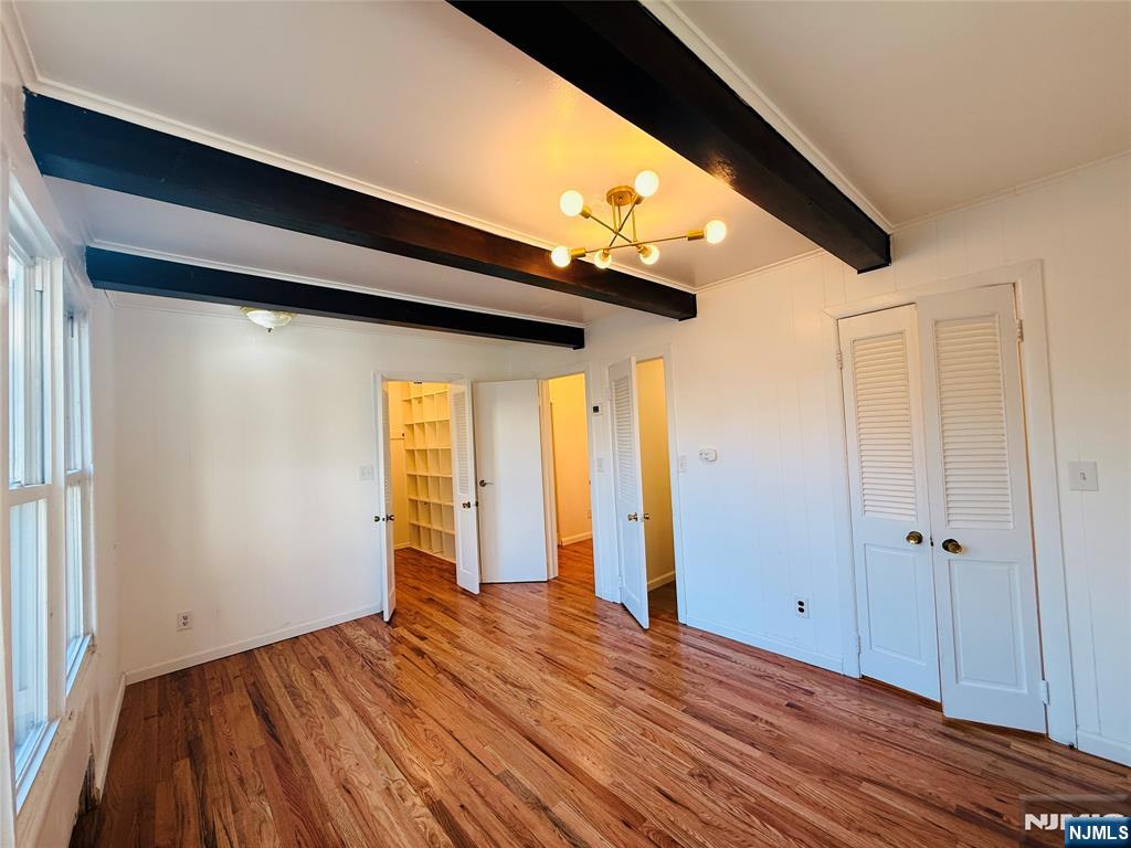 86 West Main Street, Unit FIRST Bergenfield, NJ 07621 - Photo 21 of 23 a view of empty room with wooden floor and fan